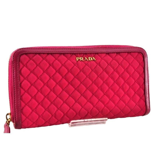 Prada pink nylon and leather zip-around wallet with minimalist design and secure closure.