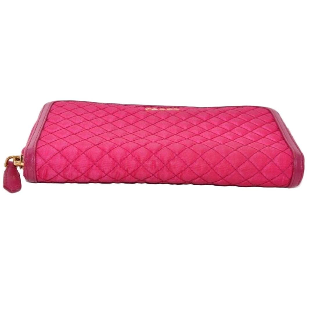 Prada pink nylon and leather zip-around wallet with minimalist design and secure closure.