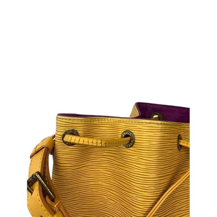 Louis Vuitton Petit Noé yellow bucket bag in Epi leather with drawstring closure.