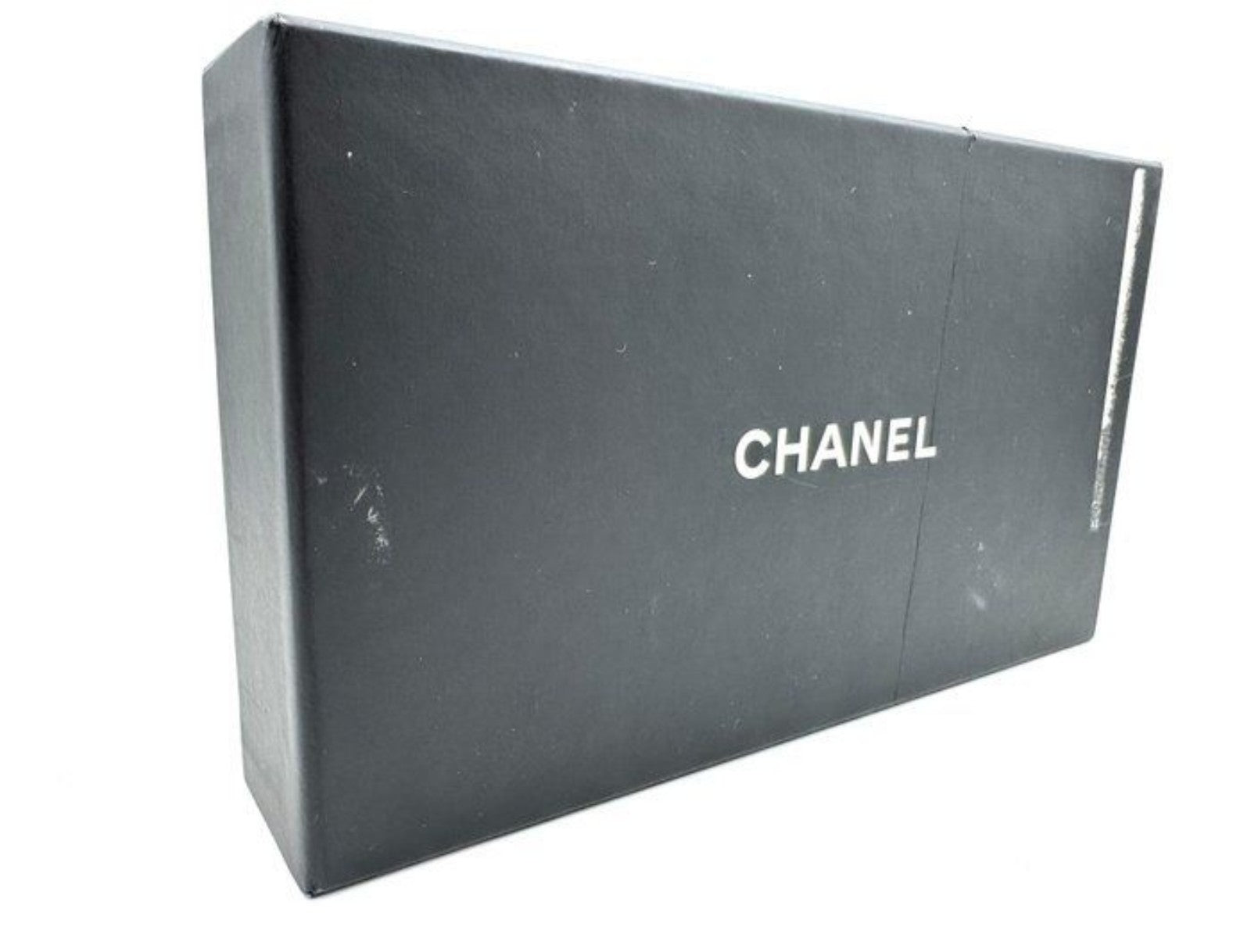 Chanel red quilted leather wallet with CC logo and fabric-lined interior.