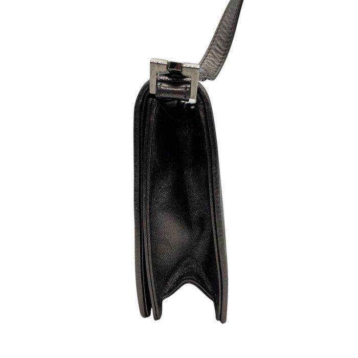Yves Saint Laurent grey metallic shoulder bag with quilted design and silver tone hardware.
