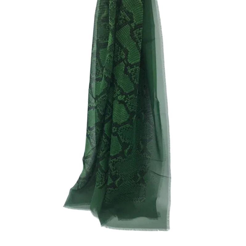 Burberry green silk scarf with delicate fringed edges and vibrant hue.