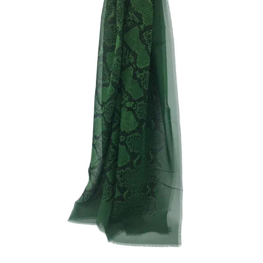 Burberry green silk scarf with delicate fringed edges and vibrant hue.