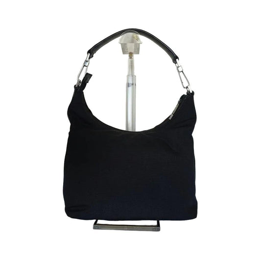 Gucci black nylon and leather shoulder bag with silver accents and logo detail.