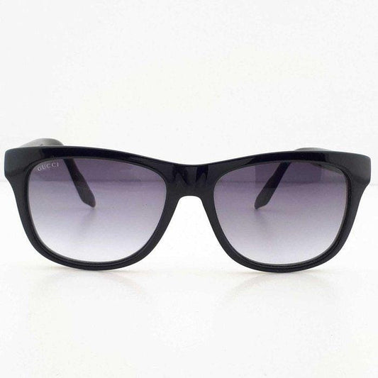 Gucci black Wayfarer sunglasses with grey gradient lenses and red-green striped temples.
