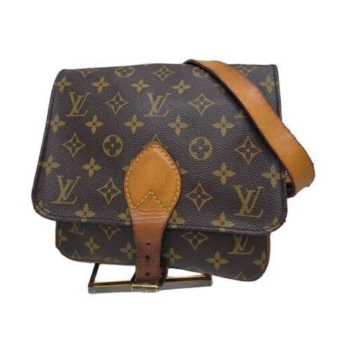 Louis Vuitton brown crossbody bag with iconic monogram canvas and aged leather trim.