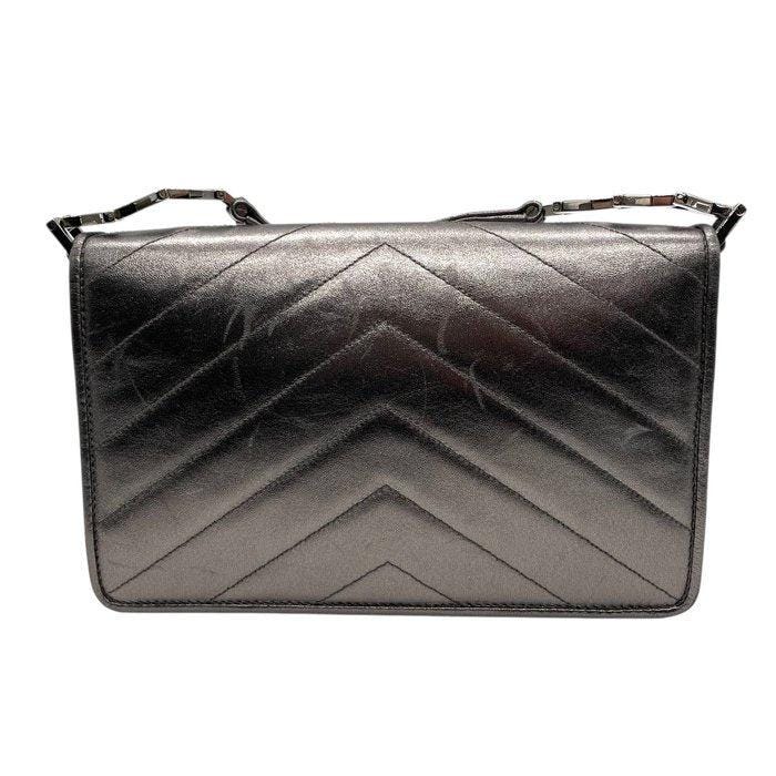 Yves Saint Laurent grey metallic shoulder bag with quilted design and silver tone hardware.
