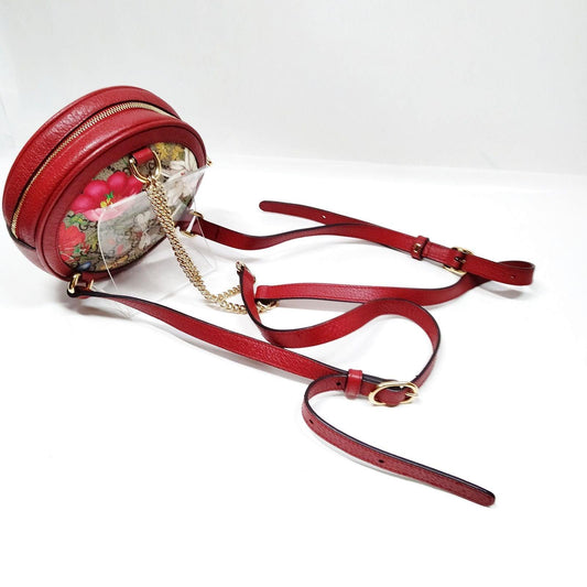 Gucci mini backpack gold GG monogram canvas with floral and butterfly print, interlocking logo.