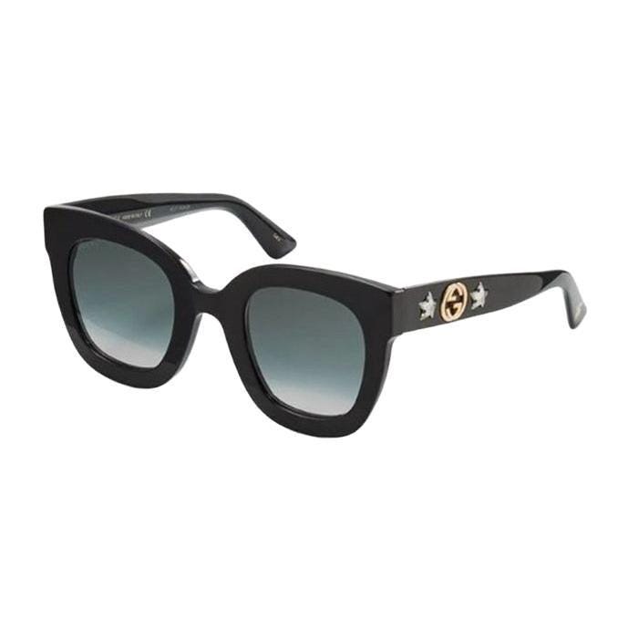 Gucci black square sunglasses with gold accents and dark category 3 lenses.
