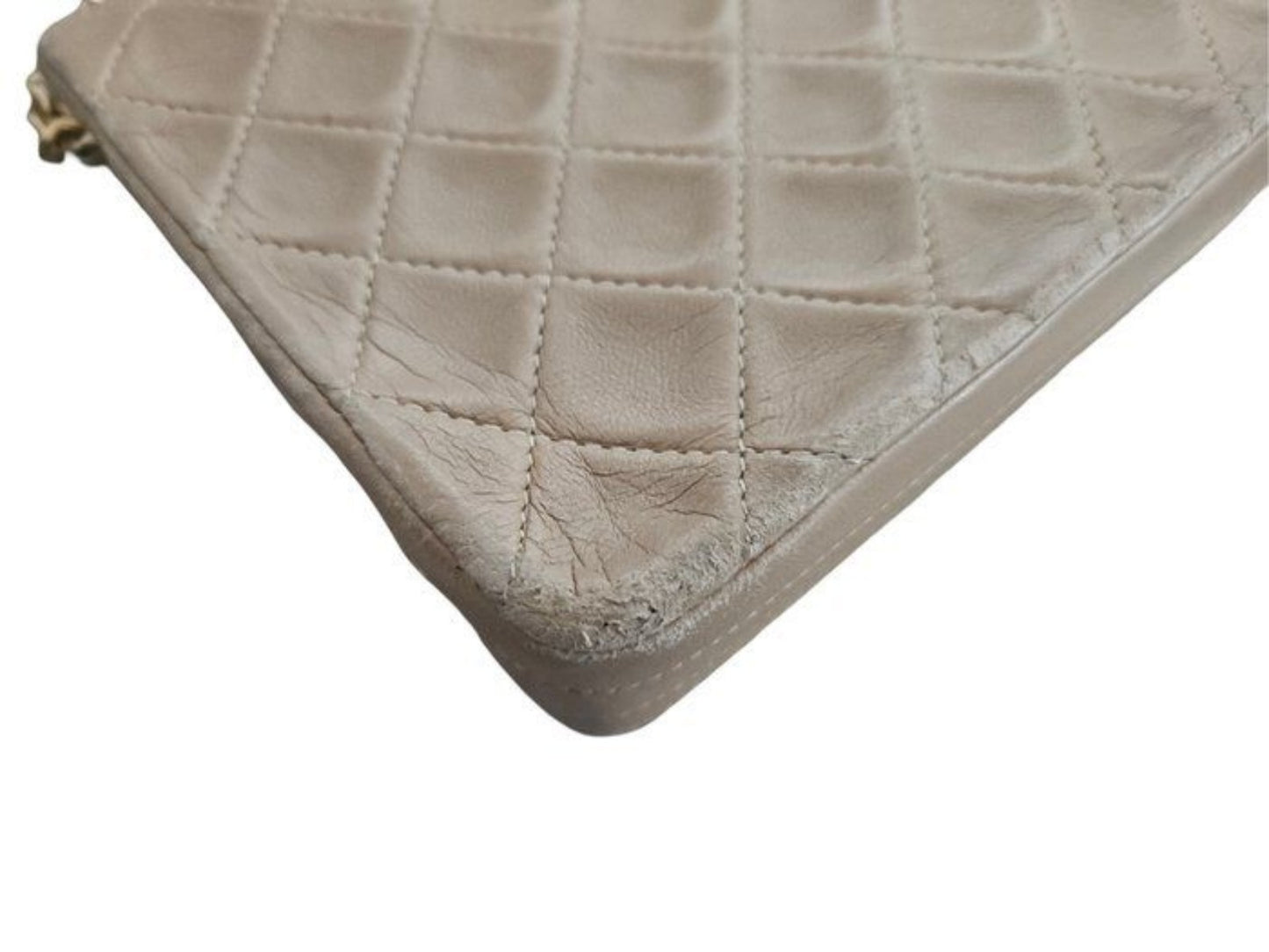 Chanel beige quilted leather flap bag with gold hardware and interlocking CC turn-lock.