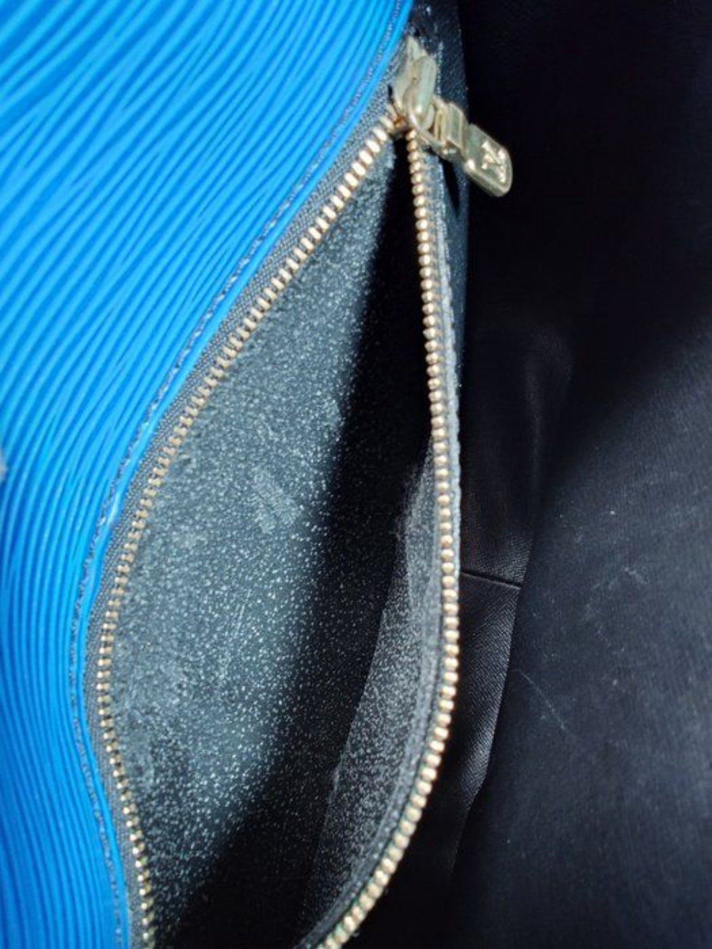Louis Vuitton blue Epi leather crossbody bag with signature LV logo and brass hardware.
