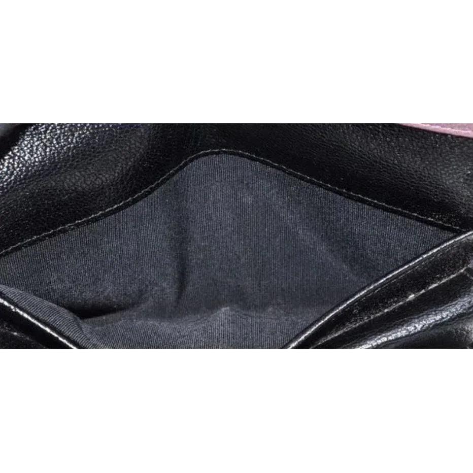 Chanel bifold wallet bordeaux leather with embossed logo and sleek design.