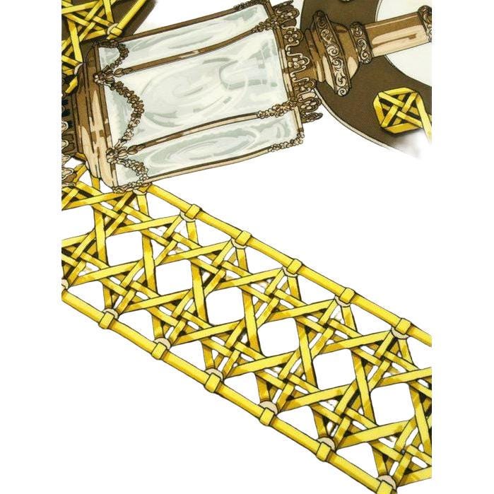 Hermès cream silk twill scarf with 'Feux de Route' design and hand-rolled hems.