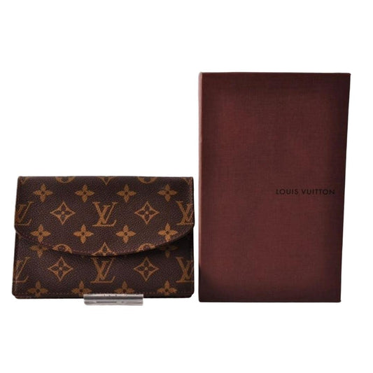 Louis Vuitton brown card case with monogram canvas and smooth leather trim.