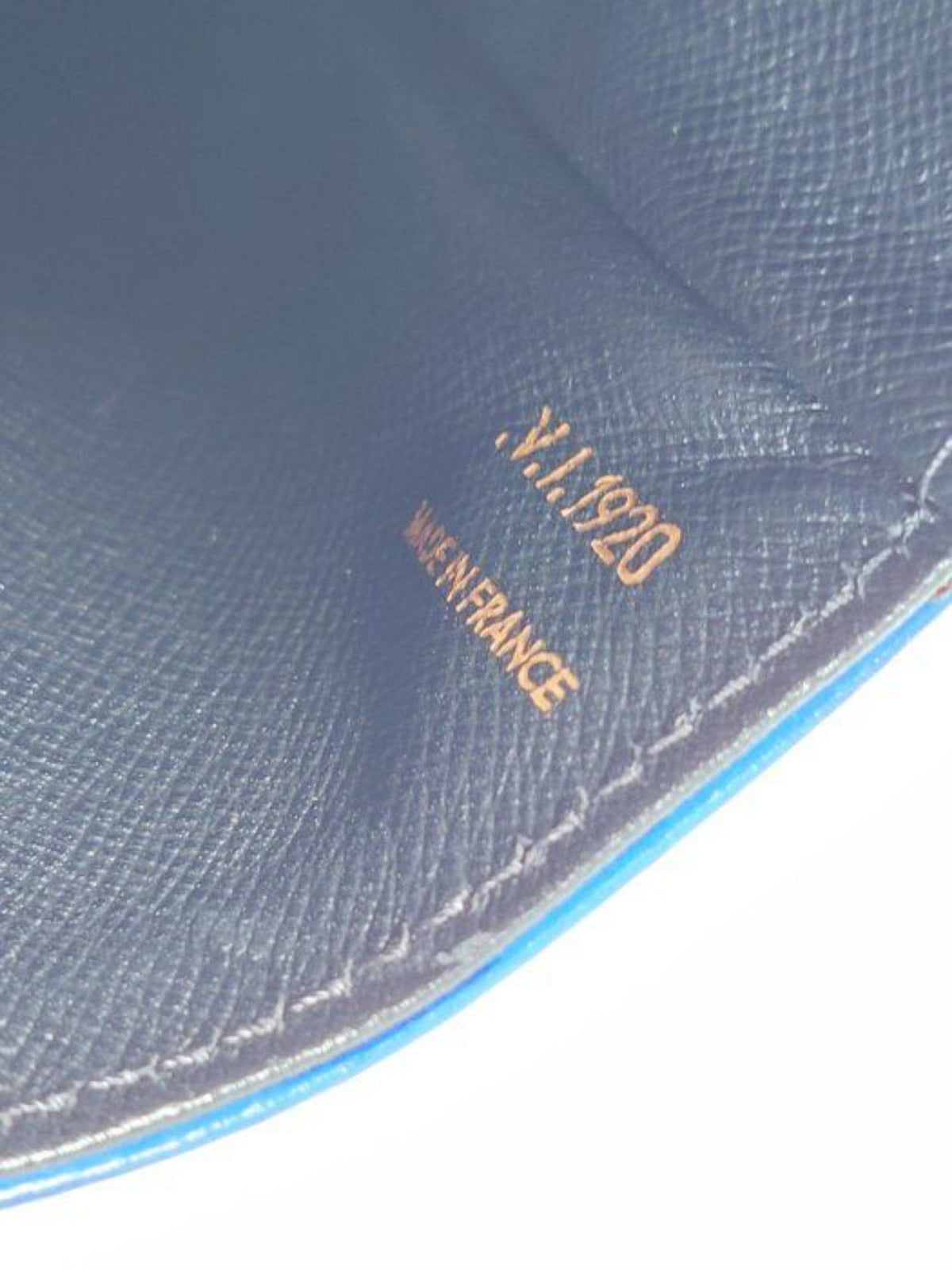 Louis Vuitton blue Epi leather crossbody bag with signature LV logo and brass hardware.
