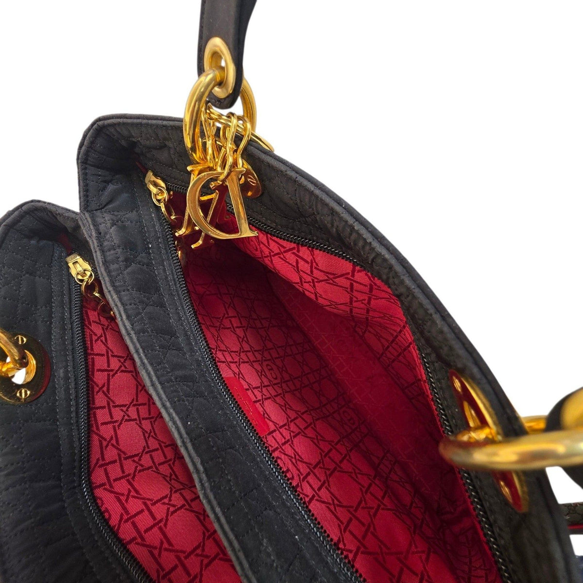 Christian Dior black quilted nylon tote bag with gold hardware and leather trim.