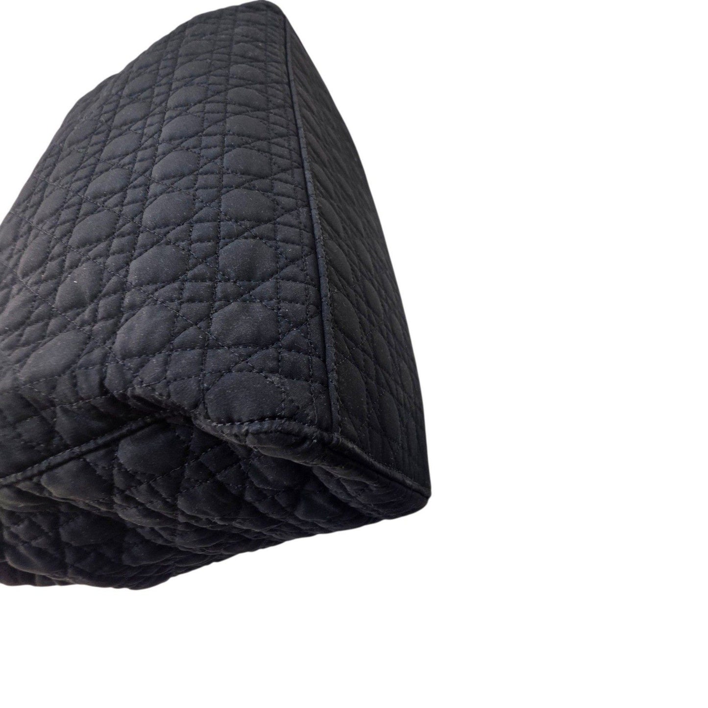 Christian Dior black quilted nylon tote bag with gold hardware and leather trim.