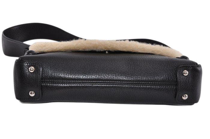 Salvatore Ferragamo black leather purse with shearling trim and Gancini hardware.