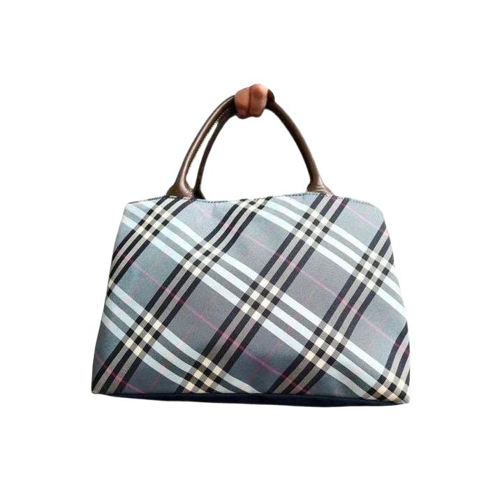Burberry beige handbag featuring Nova Check pattern and smooth calf leather accents.