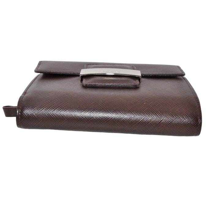Burberry brown leather bifold wallet with embossed logo and classic design.