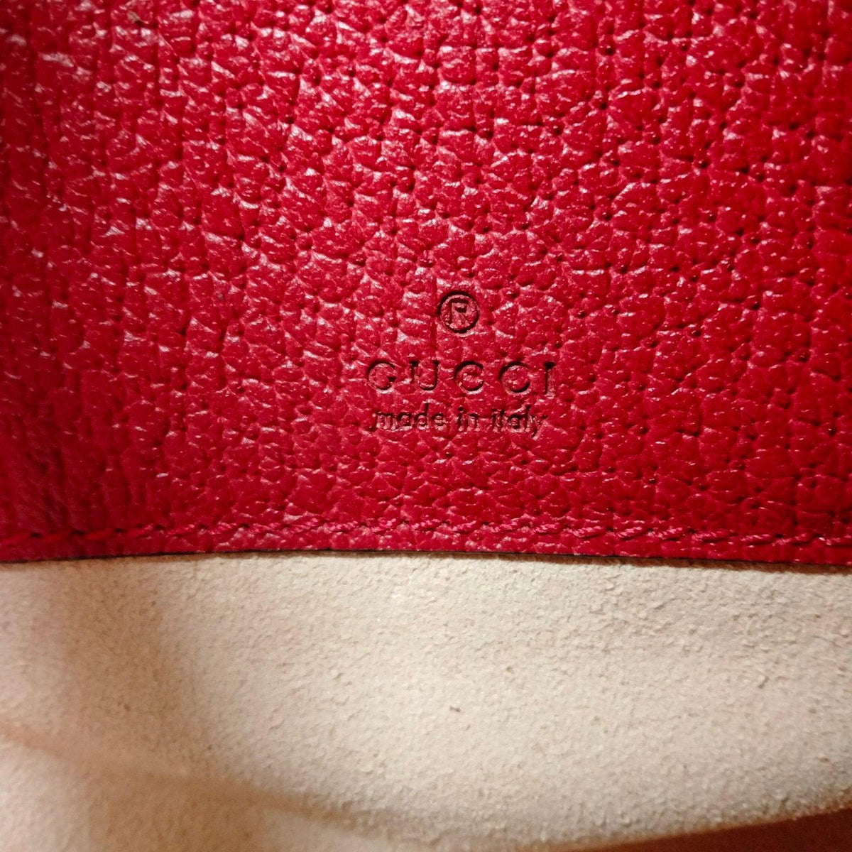Gucci mini backpack gold GG monogram canvas with floral and butterfly print, interlocking logo.