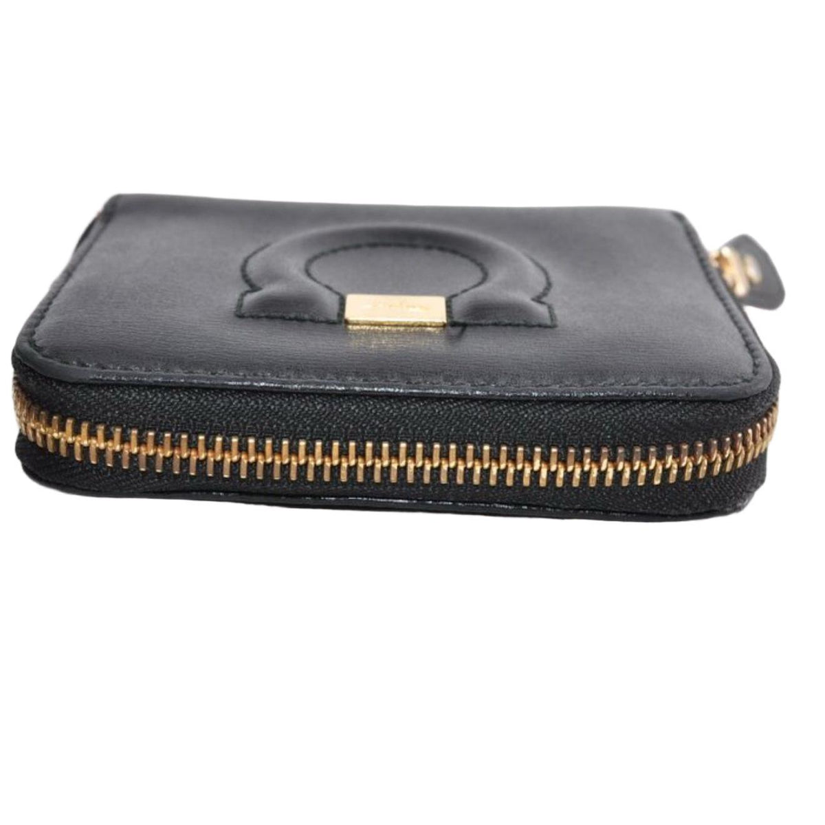 Salvatore Ferragamo cream and pink leather wallet with gold Gancini logo and zip-around design.