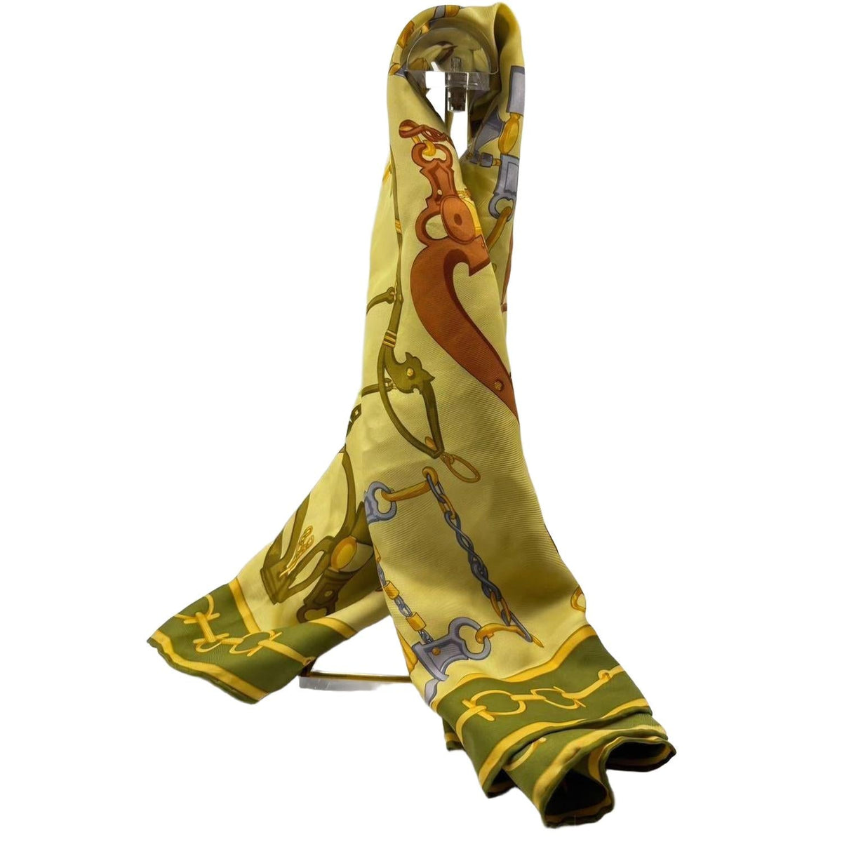 Gucci silk scarf featuring vintage equestrian print in gold, green, and yellow.