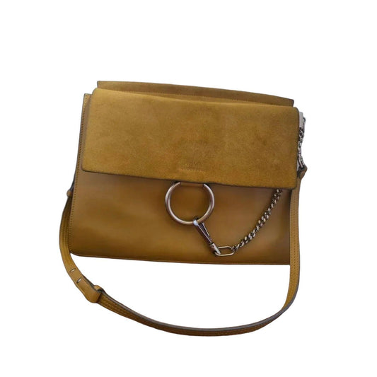 Chloè yellow messenger bag with gold-tone ring, suede and leather textures.
