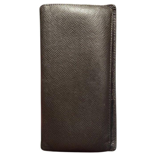 Louis Vuitton brown bi-fold wallet in Taiga leather with logo and multiple card slots.