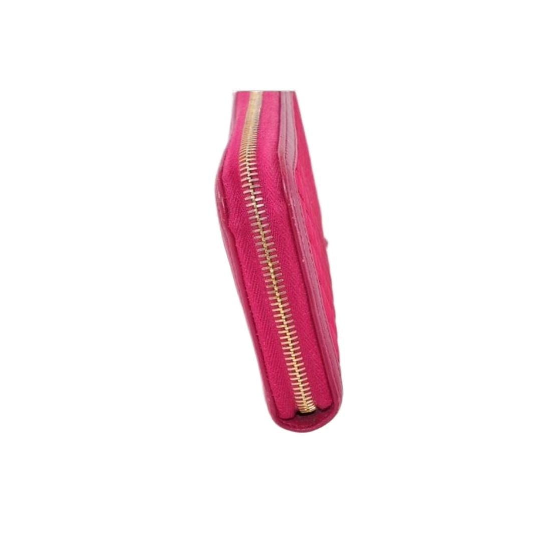 Prada pink nylon and leather zip-around wallet with minimalist design and secure closure.