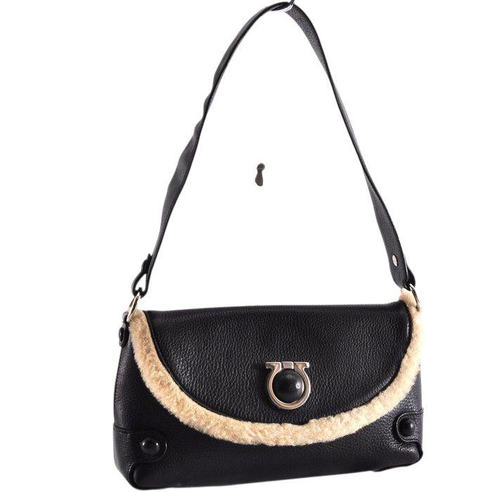 Salvatore Ferragamo black leather purse with shearling trim and Gancini hardware.