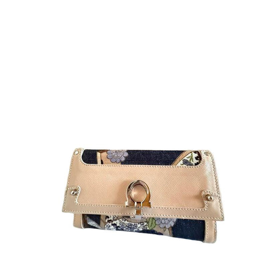 Salvatore Ferragamo burgundy wallet patent leather with iconic bow detail and signature bars.