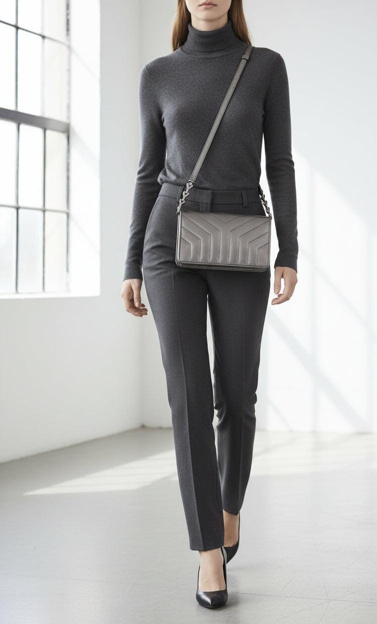 Yves Saint Laurent grey metallic shoulder bag with quilted design and silver tone hardware.