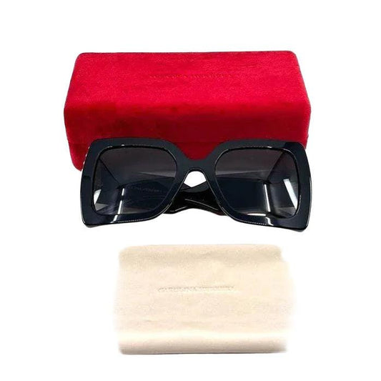 Carolina Herrera black acetate sunglasses with grey lenses and signature logo detailing.