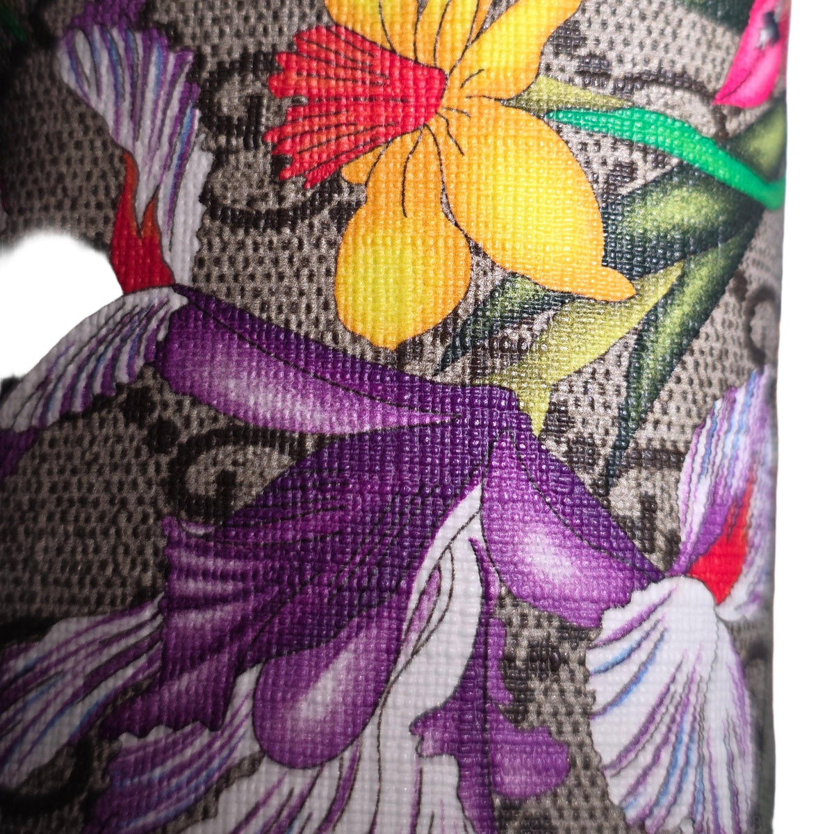 Gucci cream cosmetic case with floral pattern, GG Supreme canvas, and gold hardware.