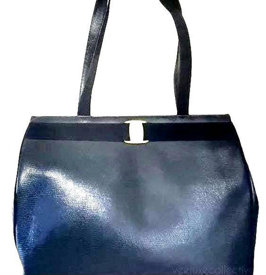 Salvatore Ferragamo blue handbag with gold-tone hardware and signature monogram lining.