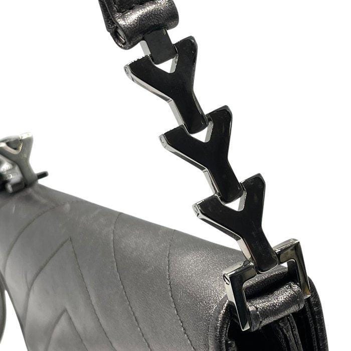 Yves Saint Laurent grey metallic shoulder bag with quilted design and silver tone hardware.