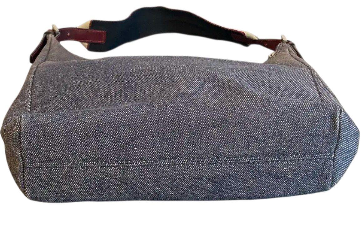 Burberry blue denim shoulder bag with leather trim and polished metal hardware.