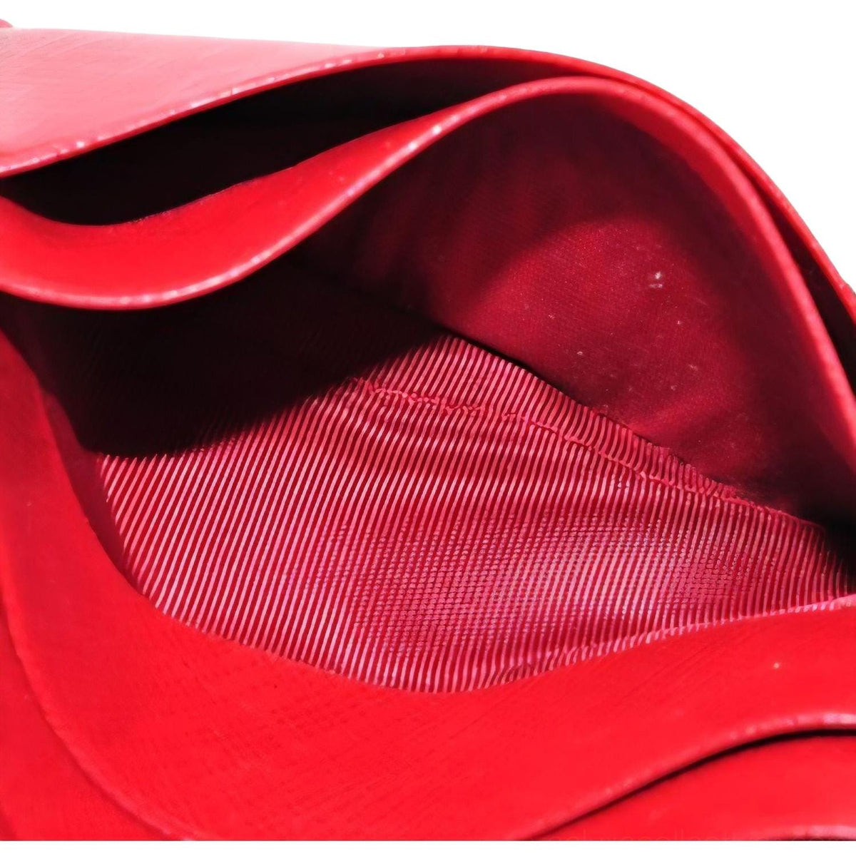 Salvatore Ferragamo red leather wallet with gold hardware and organized interior.