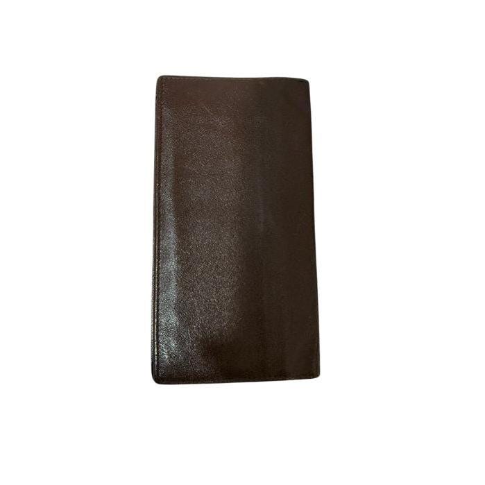 Gucci brown bifold wallet smooth leather with iconic logo and vintage craftsmanship.