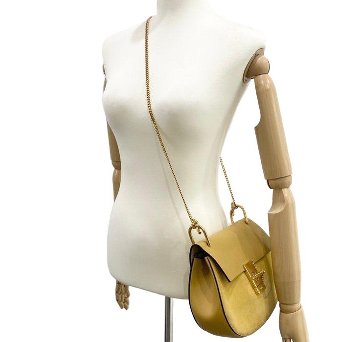 Chloè yellow suede messenger bag with gold-plated hardware and smooth leather accents.