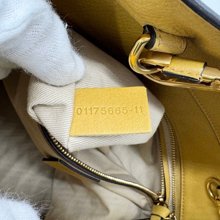 Chloè yellow suede and leather shoulder bag with gold-plated hardware and two-way design.