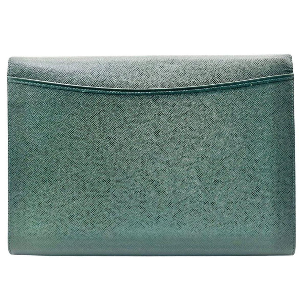 Louis Vuitton gold and green Volga clutch bag in Taiga leather with gold-tone hardware.