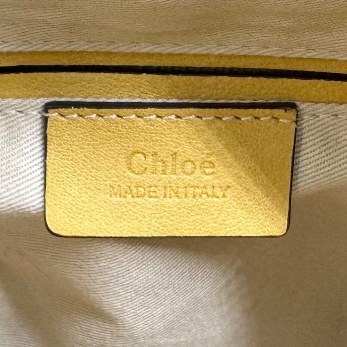 Chloè yellow suede and leather shoulder bag with gold-plated hardware and two-way design.