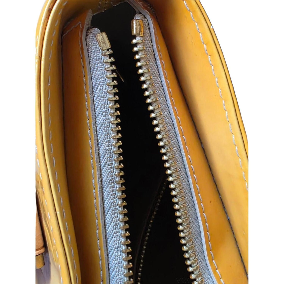 Louis Vuitton yellow Houston tote bag in glossy Monogram Vernis leather with zip closure.