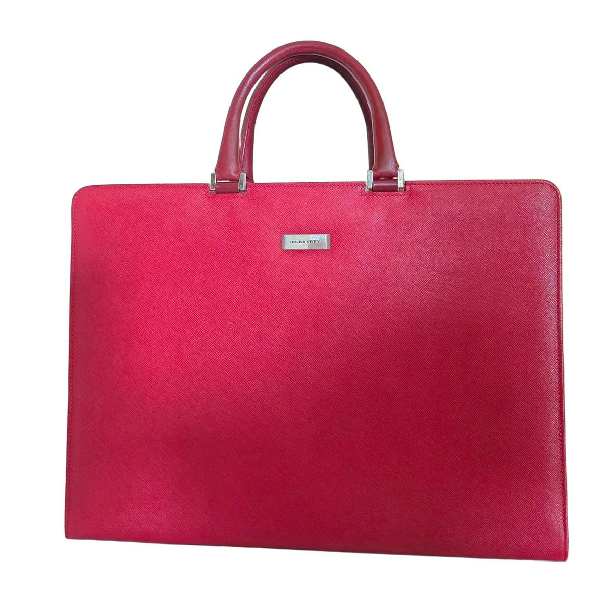 Burberry red business briefcase bag with signature logo plate and saffiano leather finish.