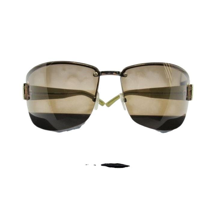 Gucci half-rim wrap sunglasses in green and gold, featuring vintage design and logo.