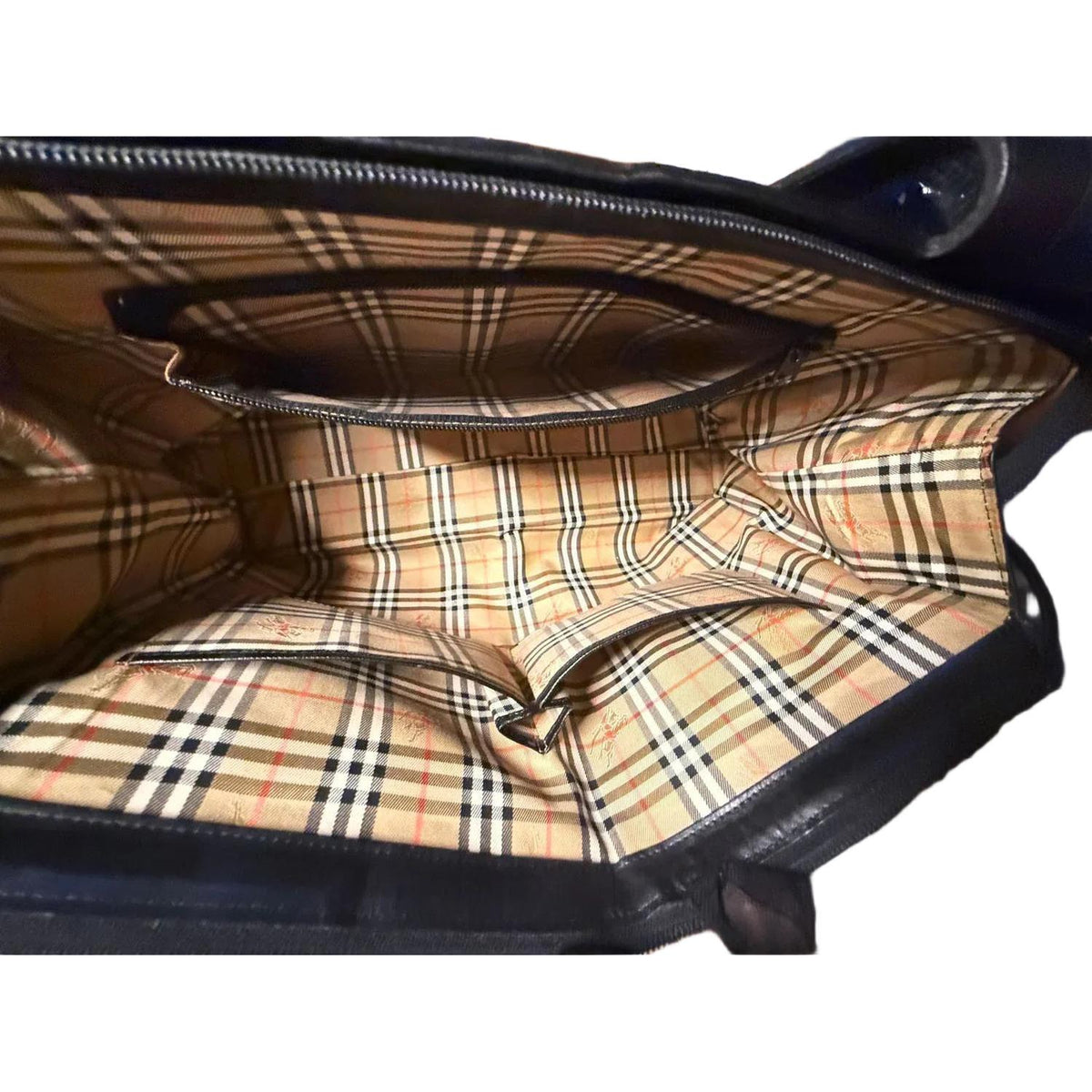 Burberry black tote bag with Nova Check accents and premium calf leather finish.