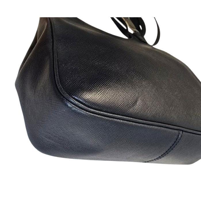 Salvatore Ferragamo black hobo bag hammered leather with metal accents and structured silhouette.