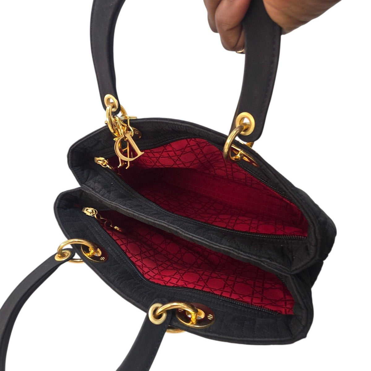 Christian Dior black quilted nylon tote bag with gold hardware and leather trim.